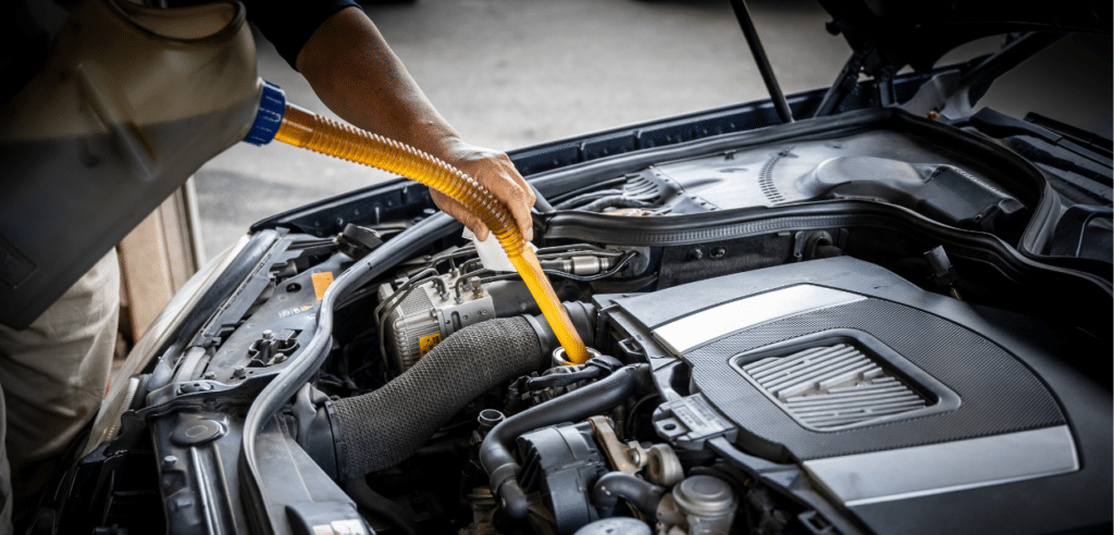 Certified mechanic performing a mobile oil change service in Orlando, ensuring convenient and reliable vehicle maintenance at your location.