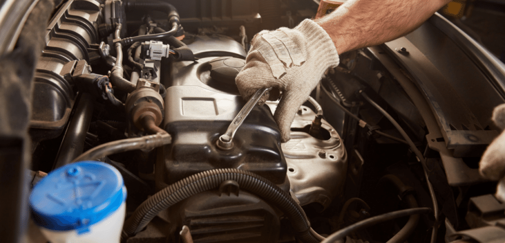 Expert mechanic conducting a mobile engine tune-up in Orlando, providing thorough and convenient engine maintenance service at your location